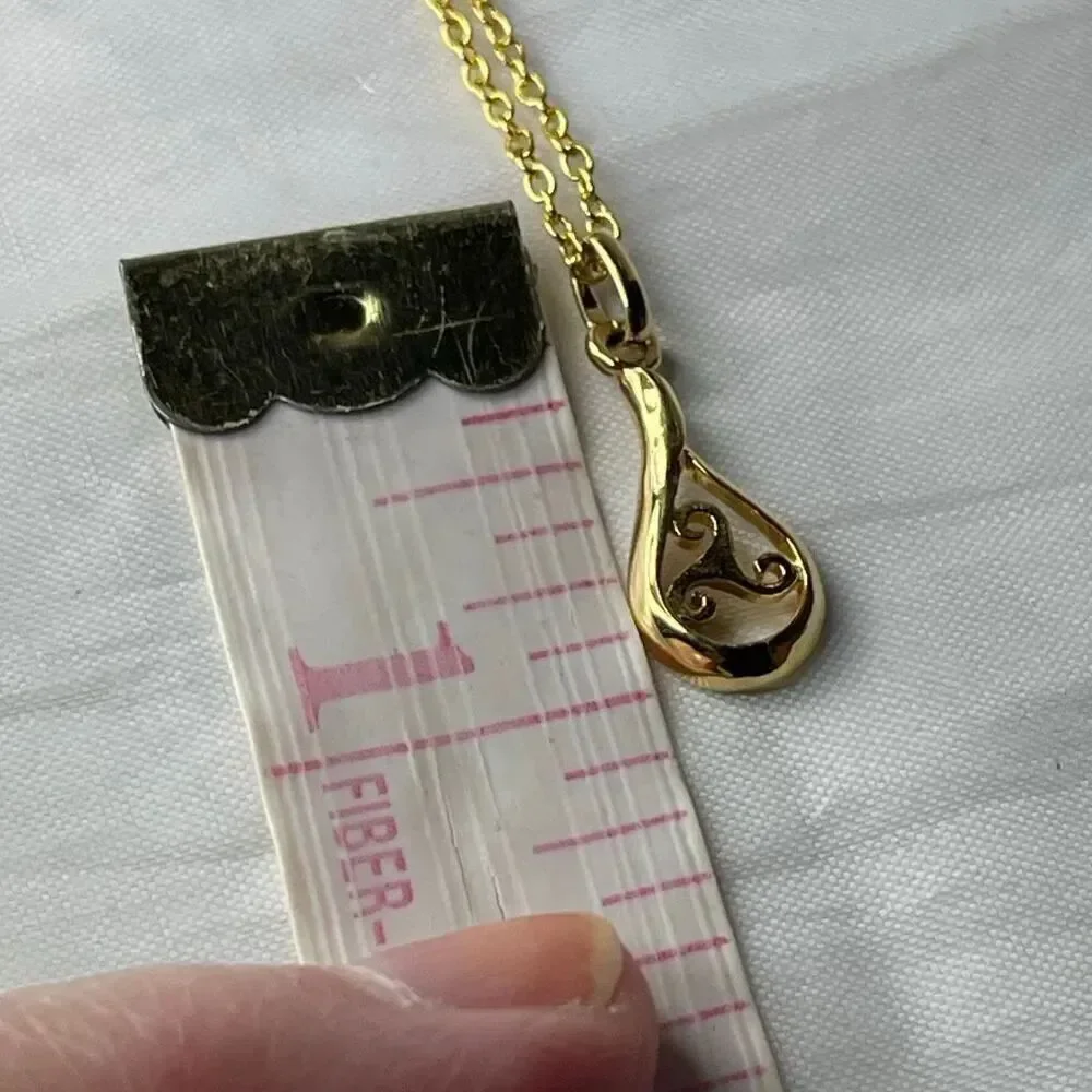 Sterling silver gold plated open work teardrop pendant and chain.